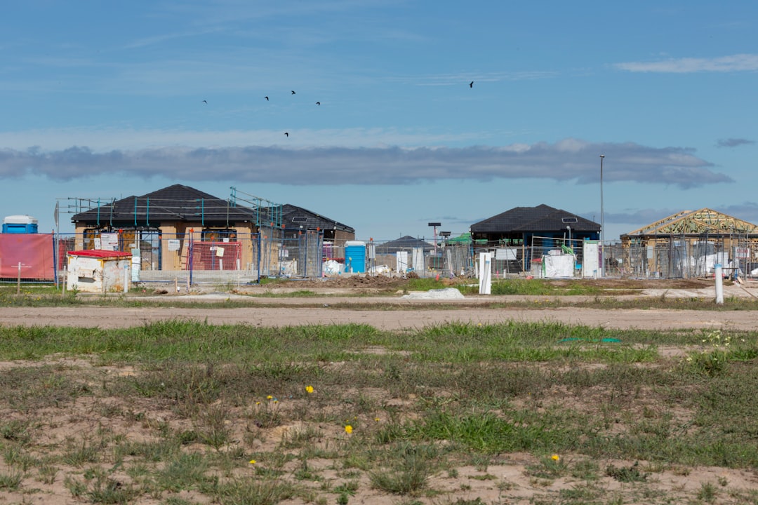 New homes under construction on a sunny day